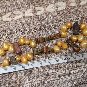 Long rice pearl and mixed bead necklace. No clasp. Easy layering.